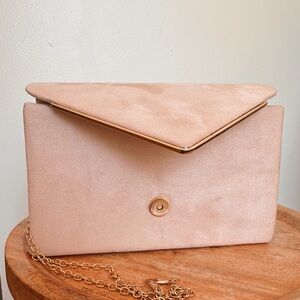 Pink suede clutch with rose gold chain strap